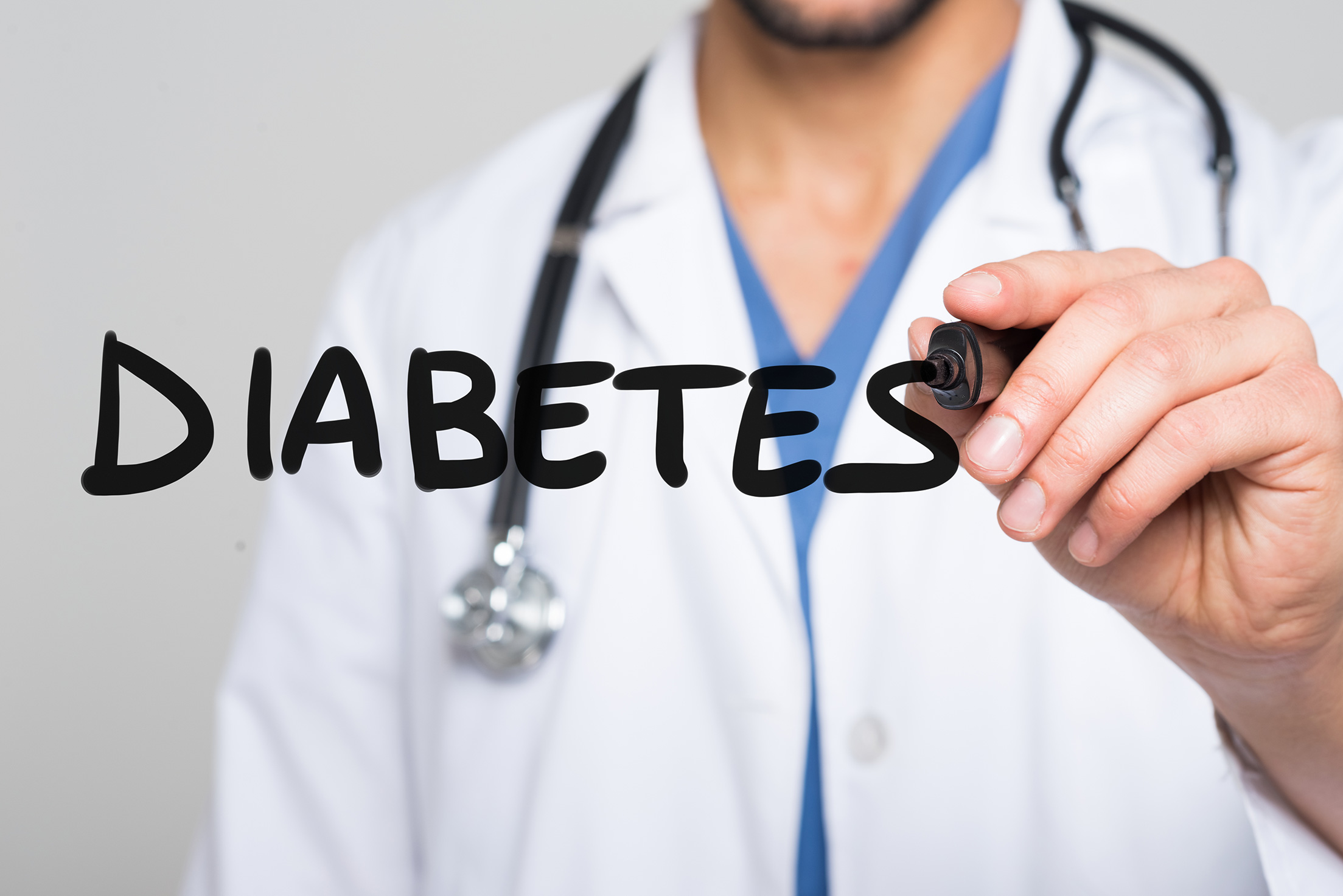 doctor-writing-word-diabetes