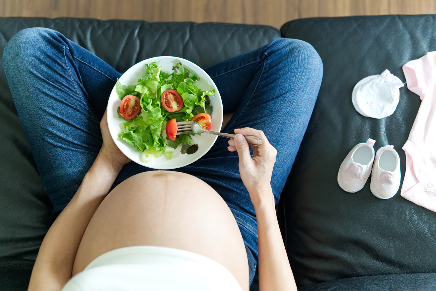pregnant-women-is-holding-salad-bowl-her-handd